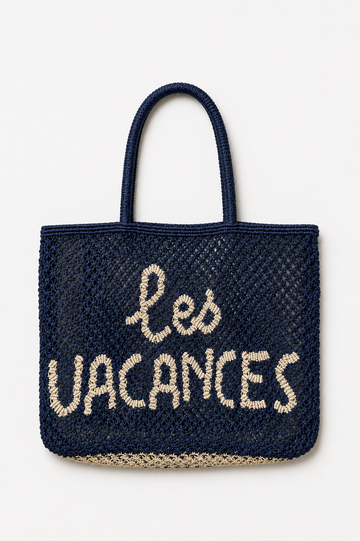 Woven navy bag with a slogan on it on a white background