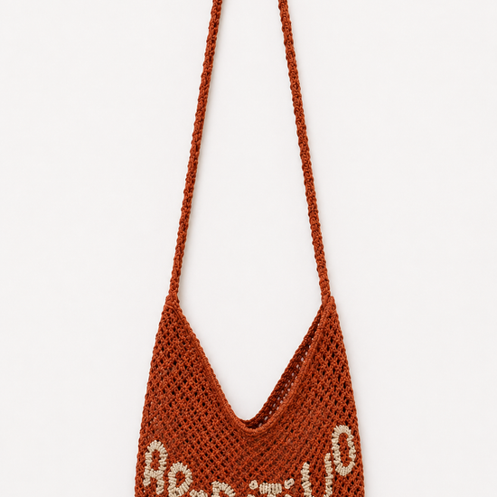 Red woven bag with 'Aperitivo' on a white background