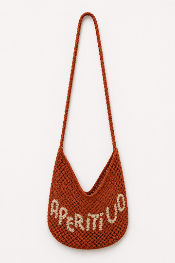 Red woven bag with 'Aperitivo' on a white background