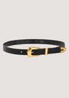 Black belt with a gold buckle on a light gray background