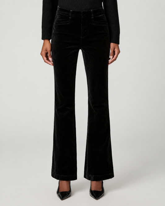 Close up of bootcut velvet trouser worn with black court shoe