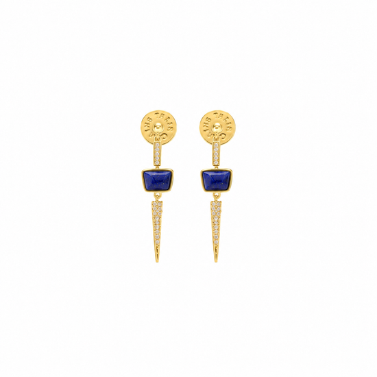 A pair of gold drop earrings featuring a rectangular blue stone in the center, a round gold top with tiny clear stones, and a pointed gold lower section accented with small clear stones, set against a plain white background.