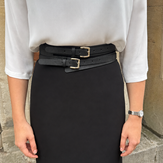 Model wearing a black leather double belt.