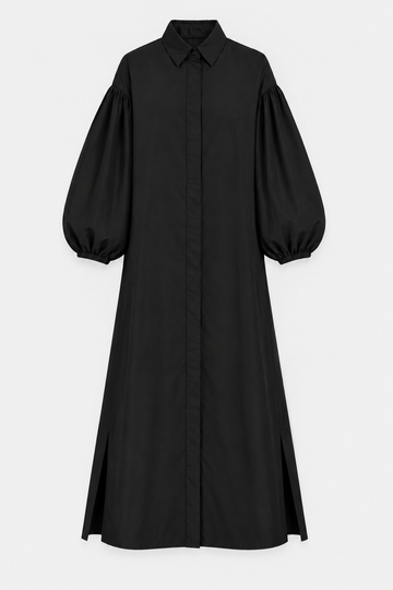 A black long-sleeve midi shirt dress with dramatic balloon sleeves, a pointed collar, and front button closure, shown against a light gray background.