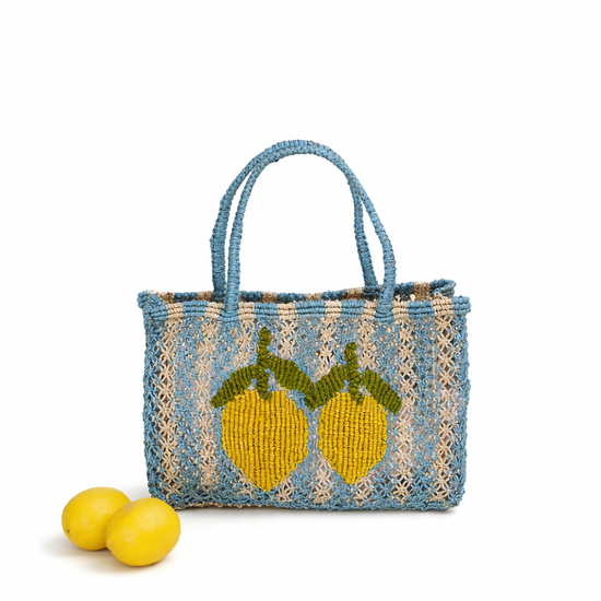 Woven bag with lemon design on a white background