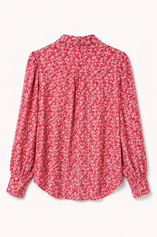 Product shot of the back of a pink floral shirt.