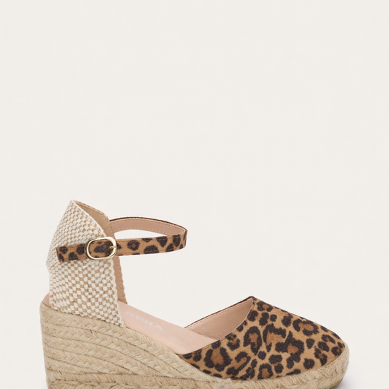 Wedge sandal with leopard print on a white background