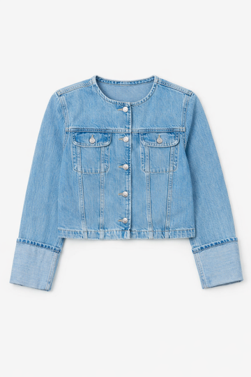 Light blue denim jacket on a white background