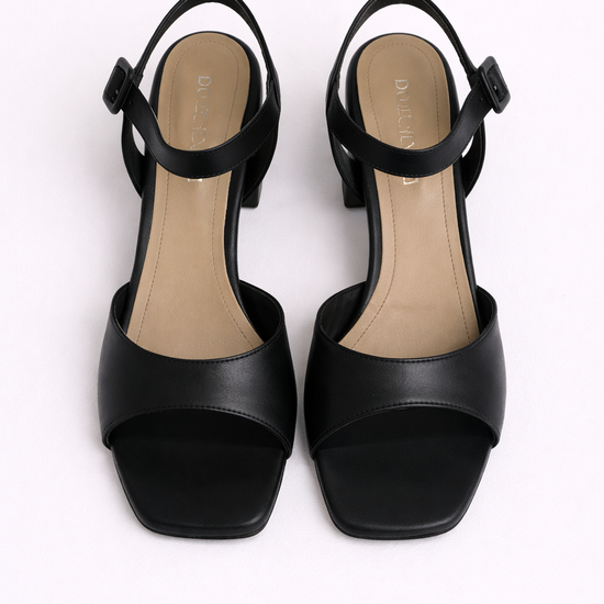 Black high-heeled sandals on a white background