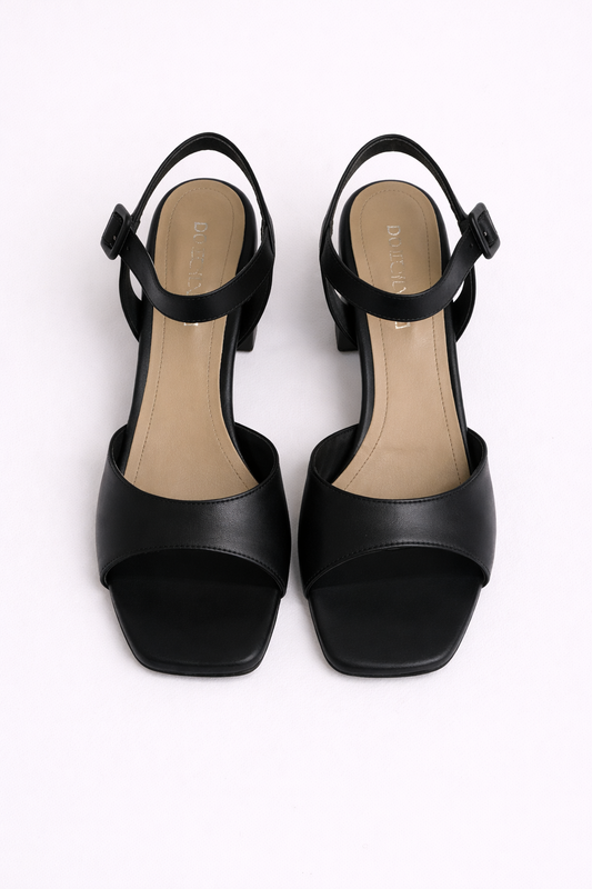 Black high-heeled sandals on a white background