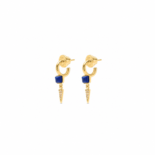 A pair of gold hoop earrings with a small square blue stone and a dangling pointed gold spike embellished with tiny clear stones, shown on a plain white background.