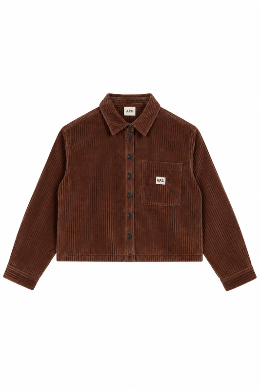 A brown corduroy button-up shirt jacket with a chest pocket and a small white square brand patch on the pocket, displayed flat against a white background.
