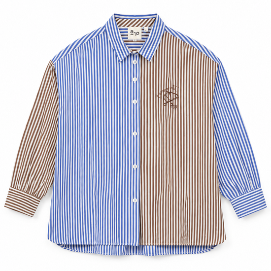 A long-sleeve button-up shirt with a split design: one half features vertical blue and white stripes, and the other half features vertical brown and white stripes. It has a small embroidered logo on the left chest and a visible 'sps' brand label inside the collar.