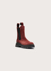 A single dark red suede Chelsea-style ankle boot with black elastic side panels and a chunky black sole, shown on a light gray background.