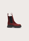 A single dark red suede Chelsea boot with a black elastic side panel and a chunky black lug sole, shown in profile against a light beige background.