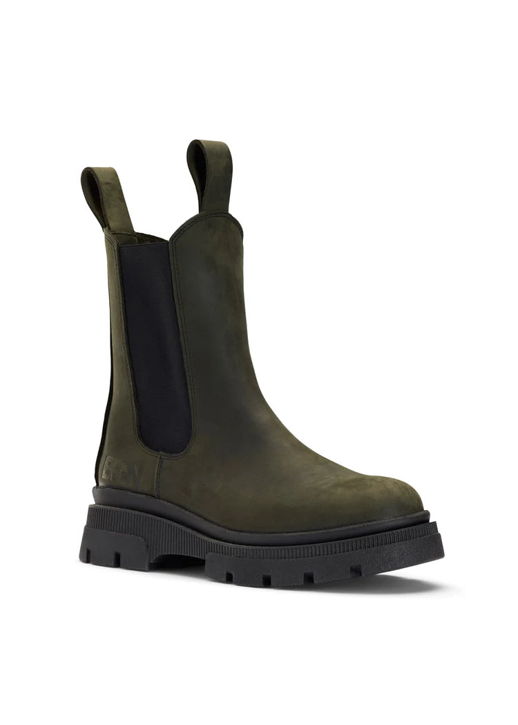 green waterproof chelsea boot with black rubber sole and pull on tabs front view