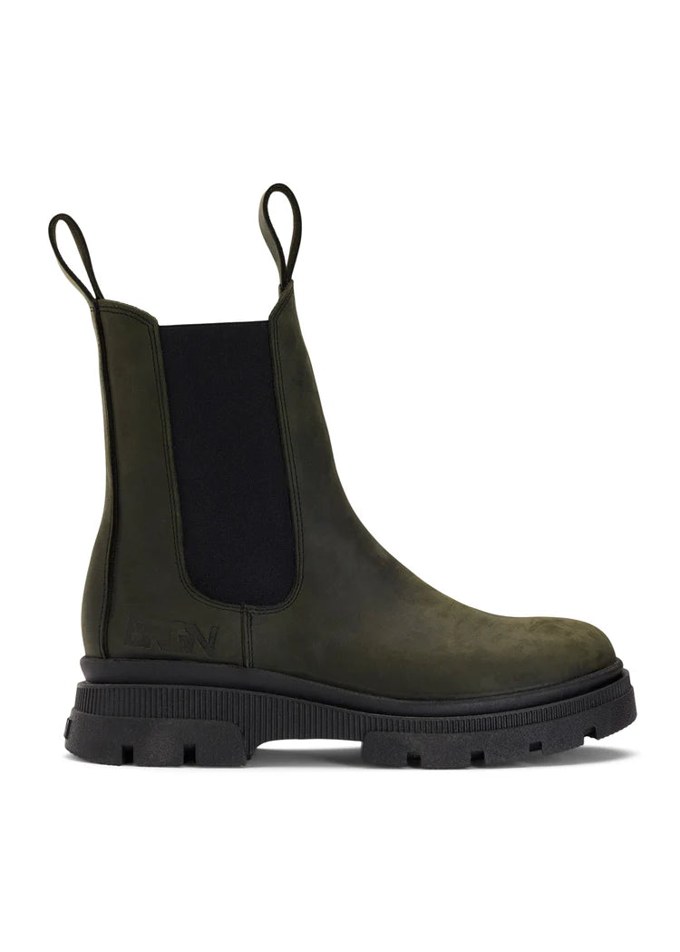 green waterproof chelsea boot with black rubber sole and pull on tabs