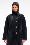 dark grey faux fur long line coat with stand neck and 3 button closure from rino and pelle close up