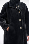 dark grey faux fur long line coat with stand neck and 3 button closure from rino and pelle close up