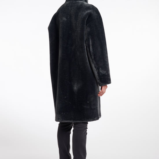 dark grey faux fur long line coat with stand neck and 3 button closure from rino and pelle rear view