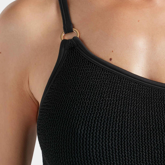 Close up shoulder detail of swimsuit