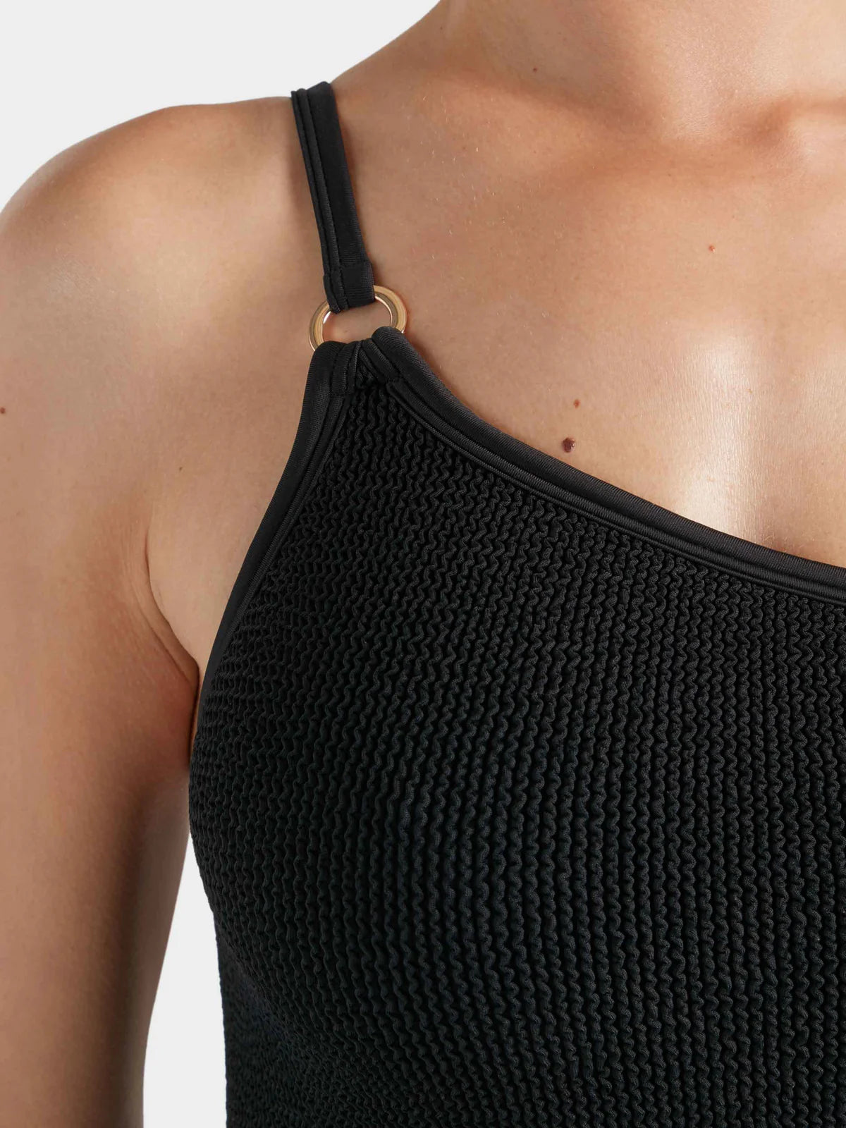 Close up shoulder detail of swimsuit