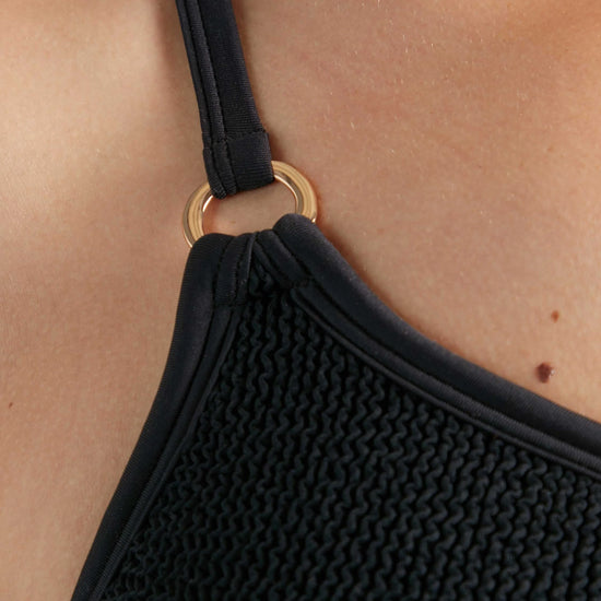 Close up detail of one shoulder swimsuit from Hunza G