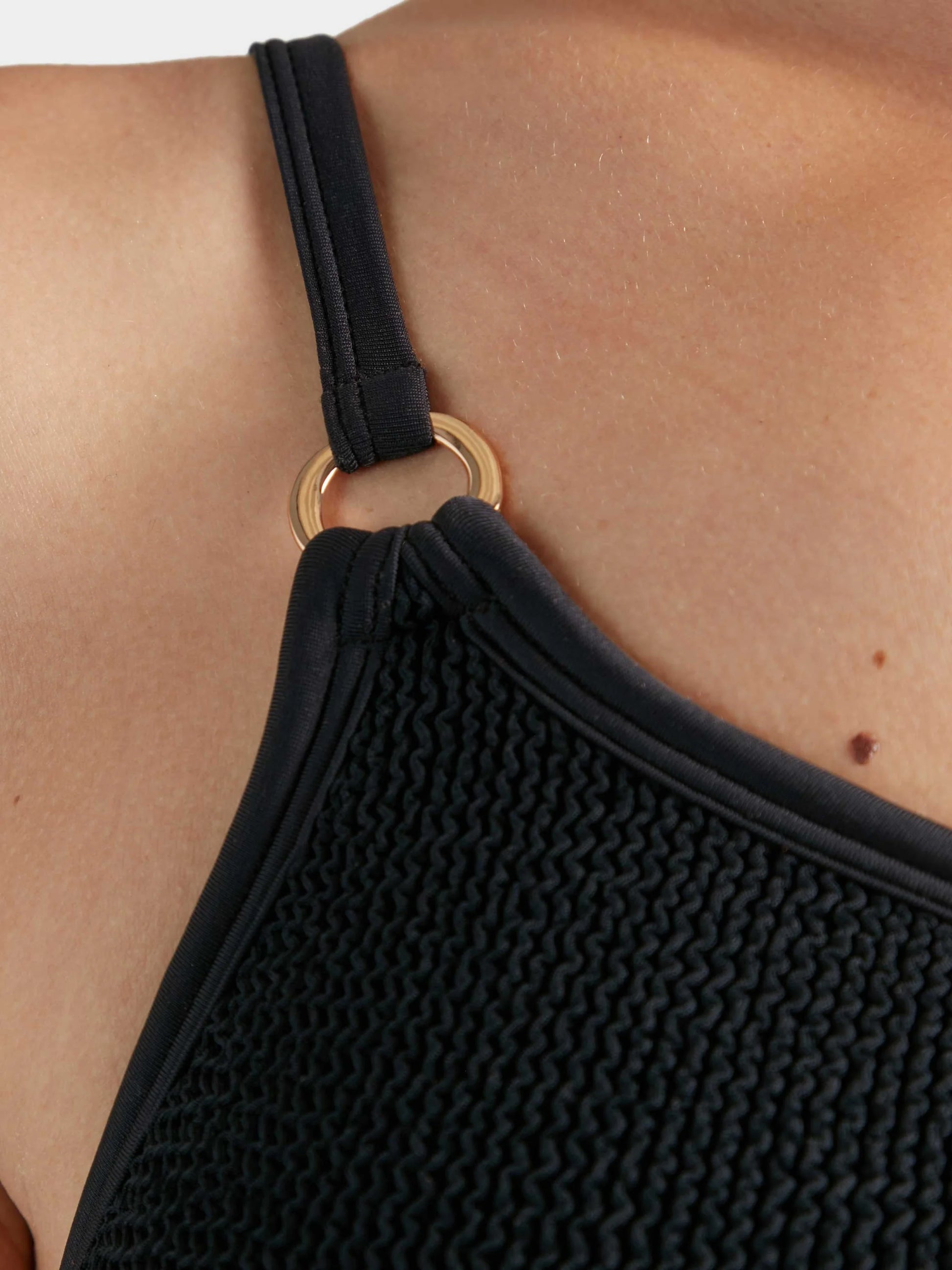 Close up detail of one shoulder swimsuit from Hunza G