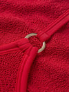 Close up detail of the fabrication of red swimsuit from Hunza G