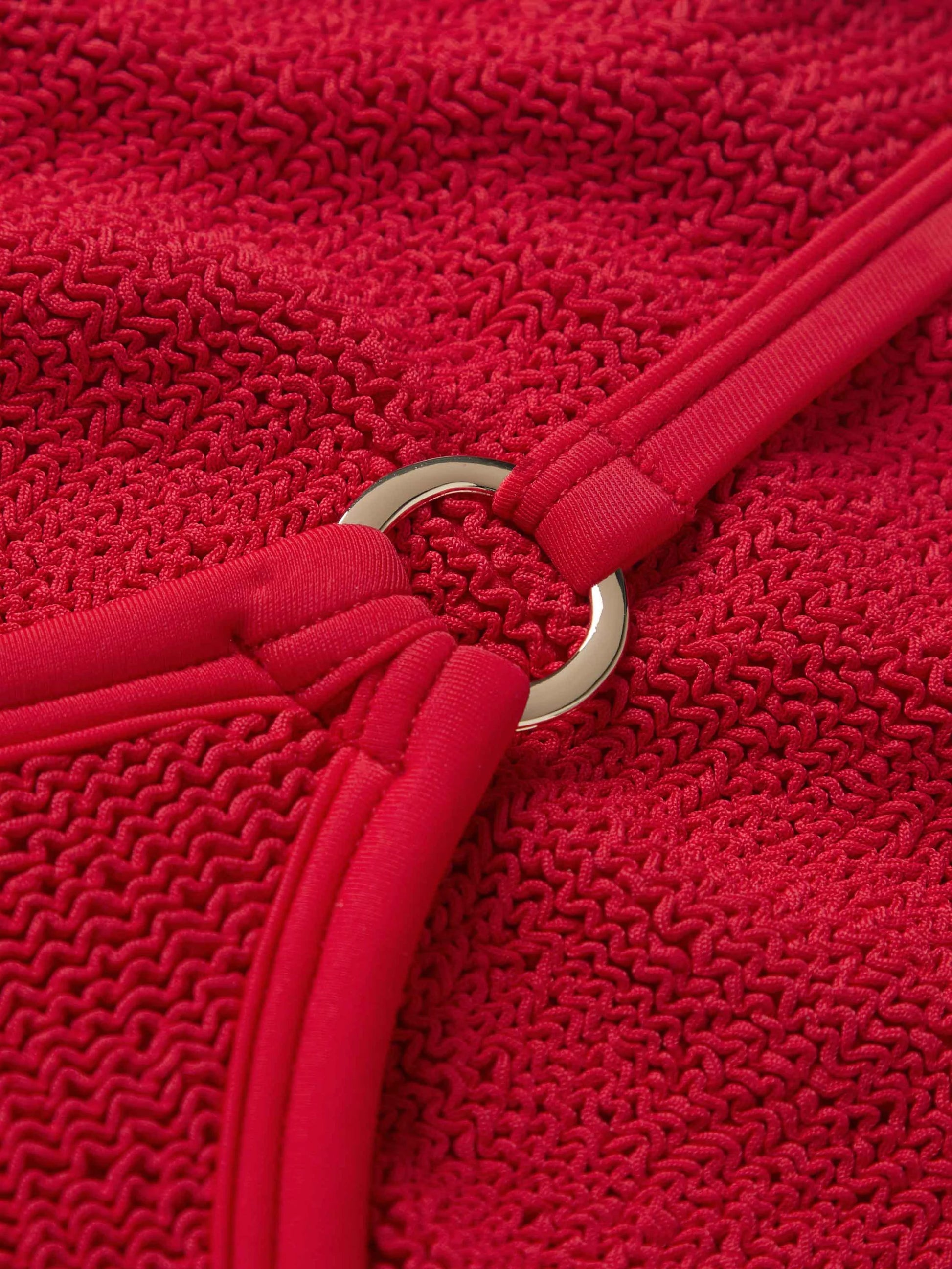 Close up detail of the fabrication of red swimsuit from Hunza G