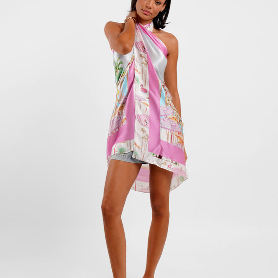 Woman wearing a colorful scarf on a white background