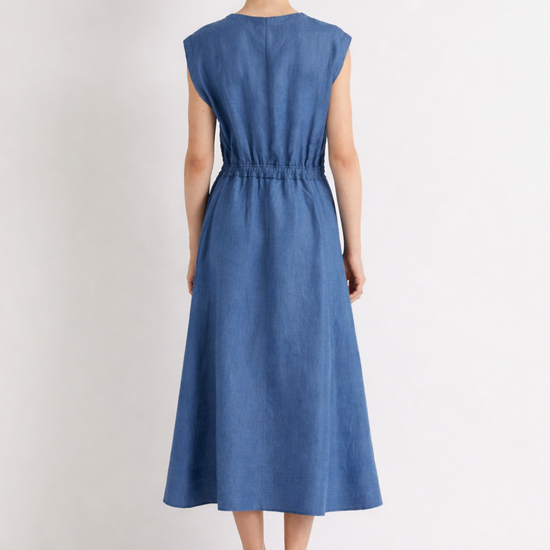 Woman wearing a blue linen dress on a white background from Mei MeiJ