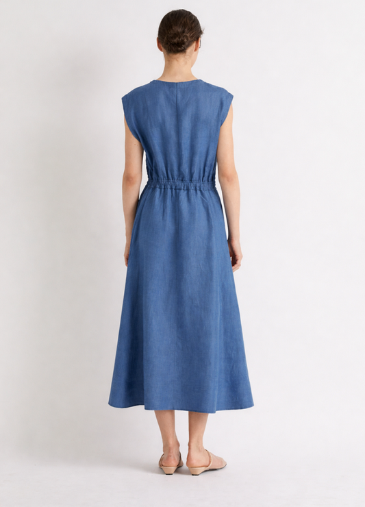 Woman wearing a blue linen dress on a white background from Mei MeiJ