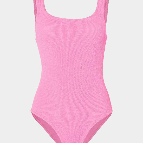 Pink swimsuit on a light gray background
