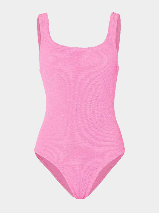 Pink swimsuit on a light gray background
