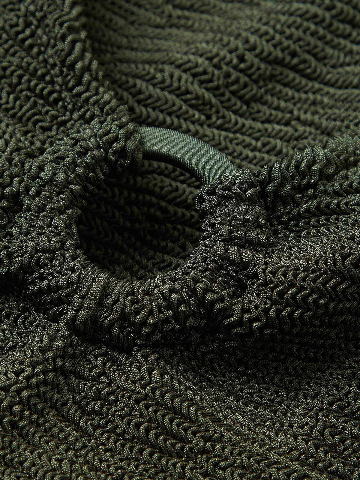 detail on green one size swimsuit