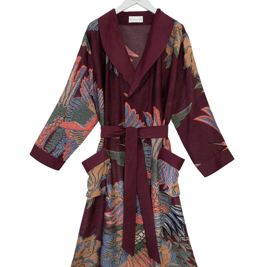 plum coloured dressing gown with vibrant crane print all over from one hundred stars
