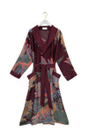 plum coloured dressing gown with vibrant crane print all over from one hundred stars
