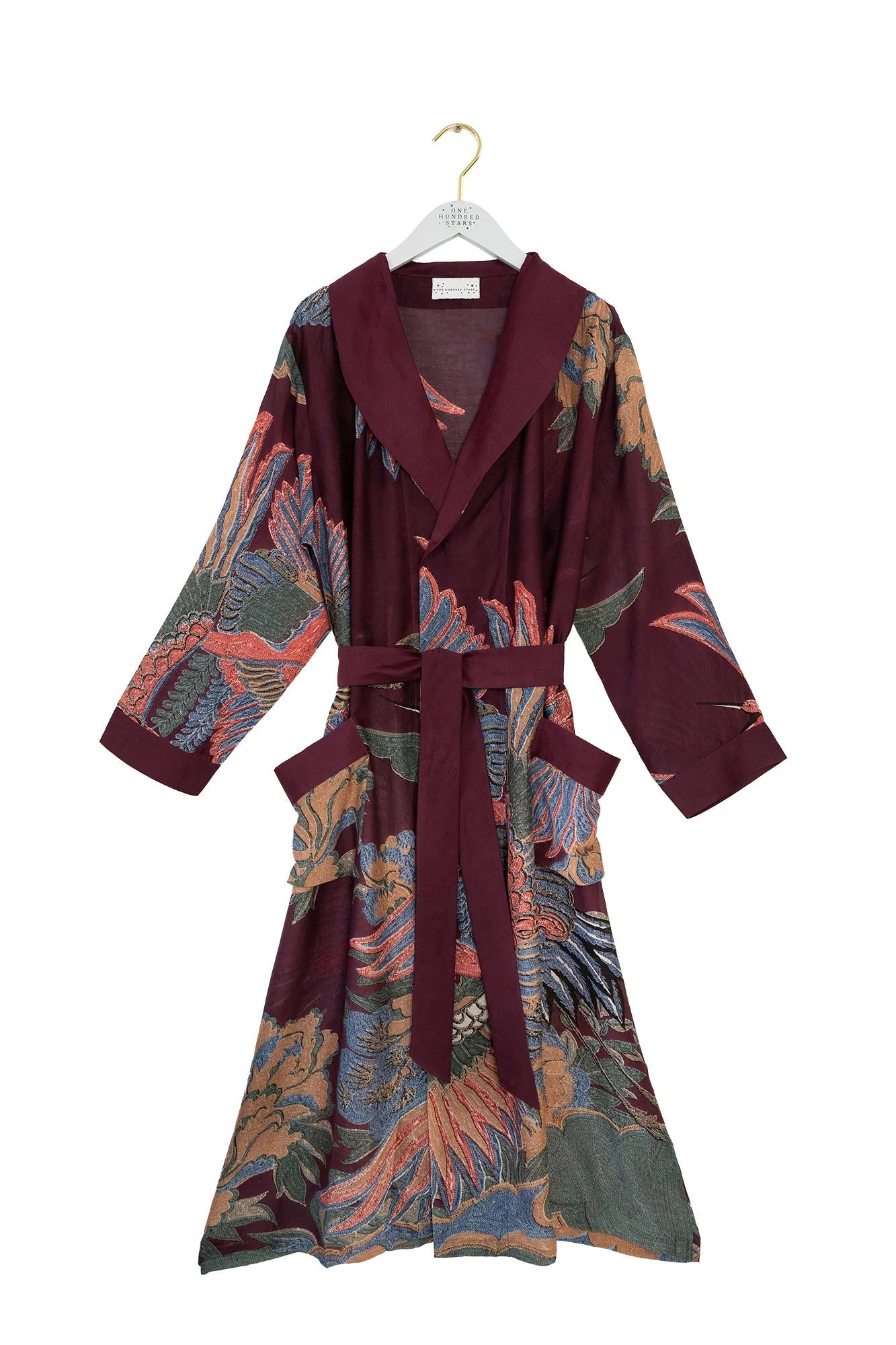 plum coloured dressing gown with vibrant crane print all over from one hundred stars