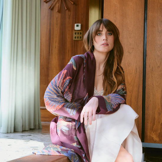 Navy blue dressing gown with colourful parsley seed plants all over from one hundred stars model shot