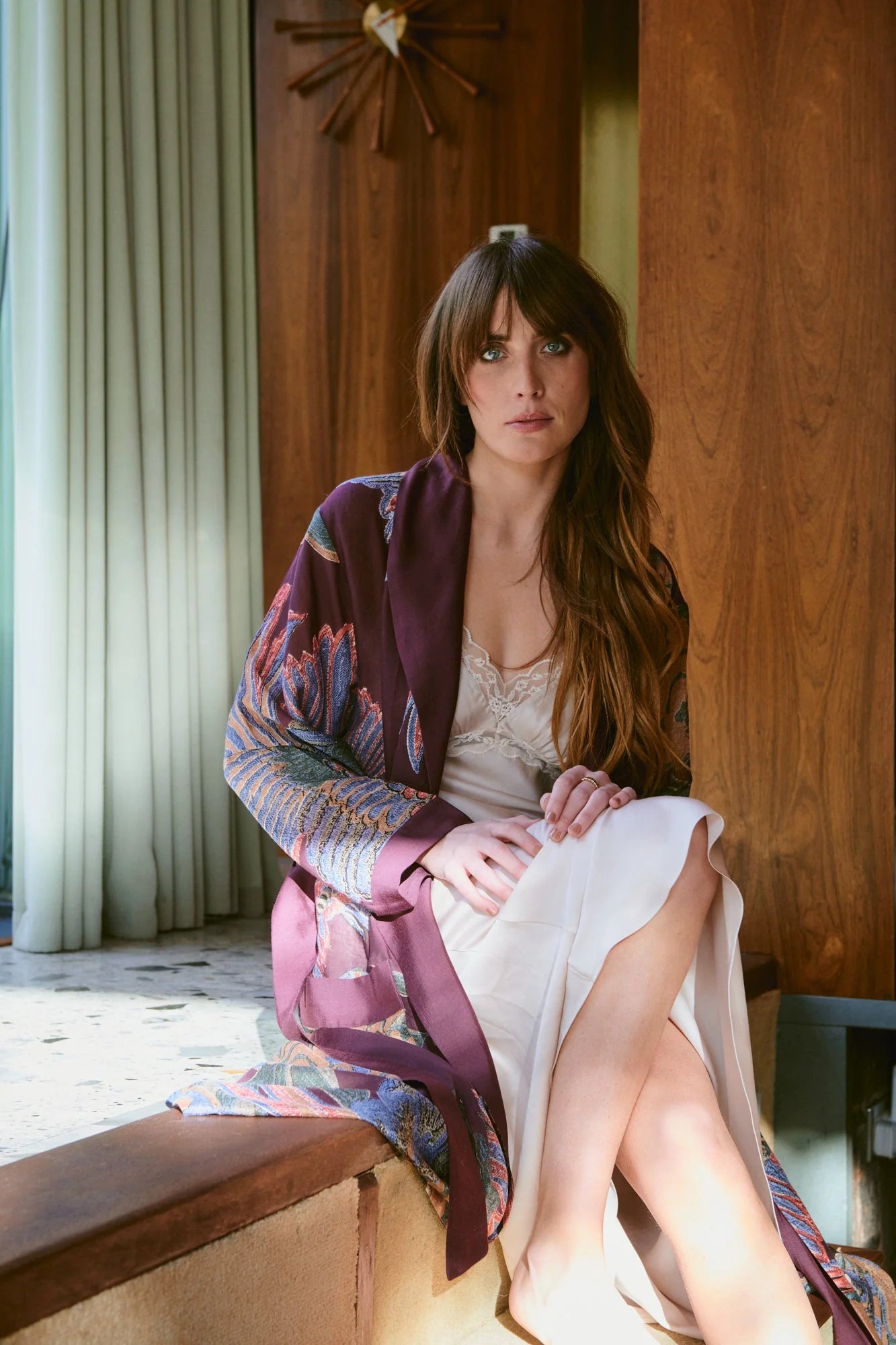 Navy blue dressing gown with colourful parsley seed plants all over from one hundred stars model shot