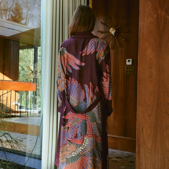 Navy blue dressing gown with colourful parsley seed plants all over from one hundred stars rear view