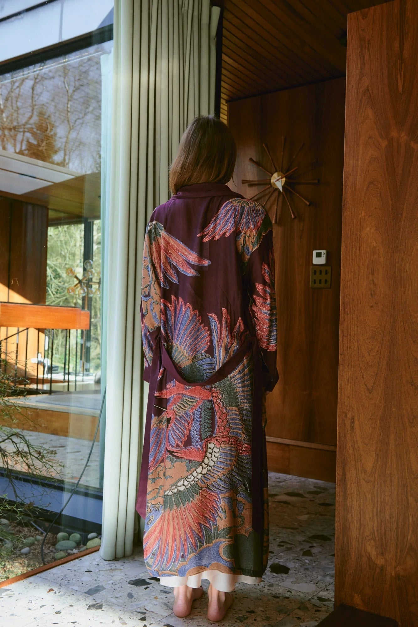 Navy blue dressing gown with colourful parsley seed plants all over from one hundred stars rear view