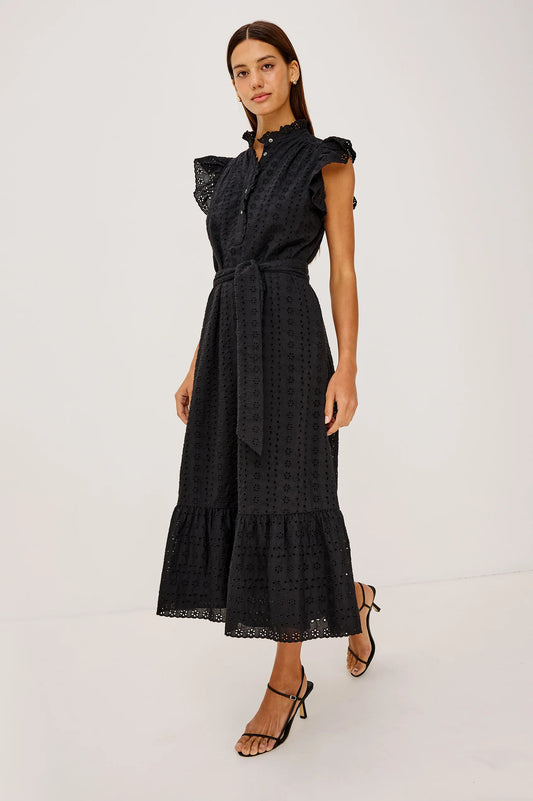 Woman wearing a black dress with ruffled sleeves on a white background from rails