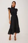 Woman wearing a black dress with ruffled sleeves on a white background from rails