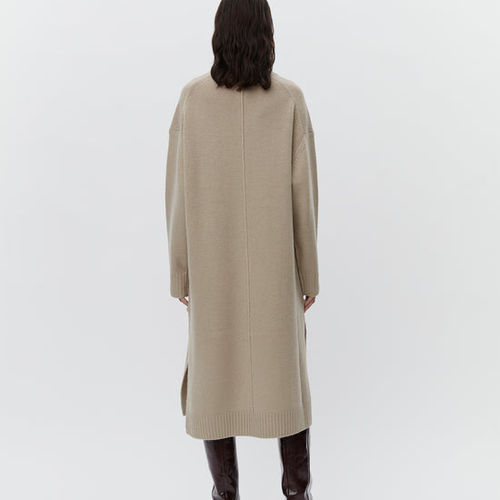 Beige wool dress with a funnel neck and long sleeves rear view