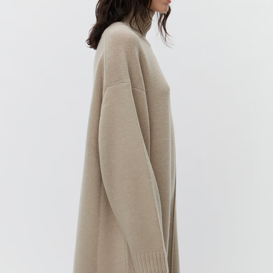 Beige wool dress with a funnel neck and long sleeves