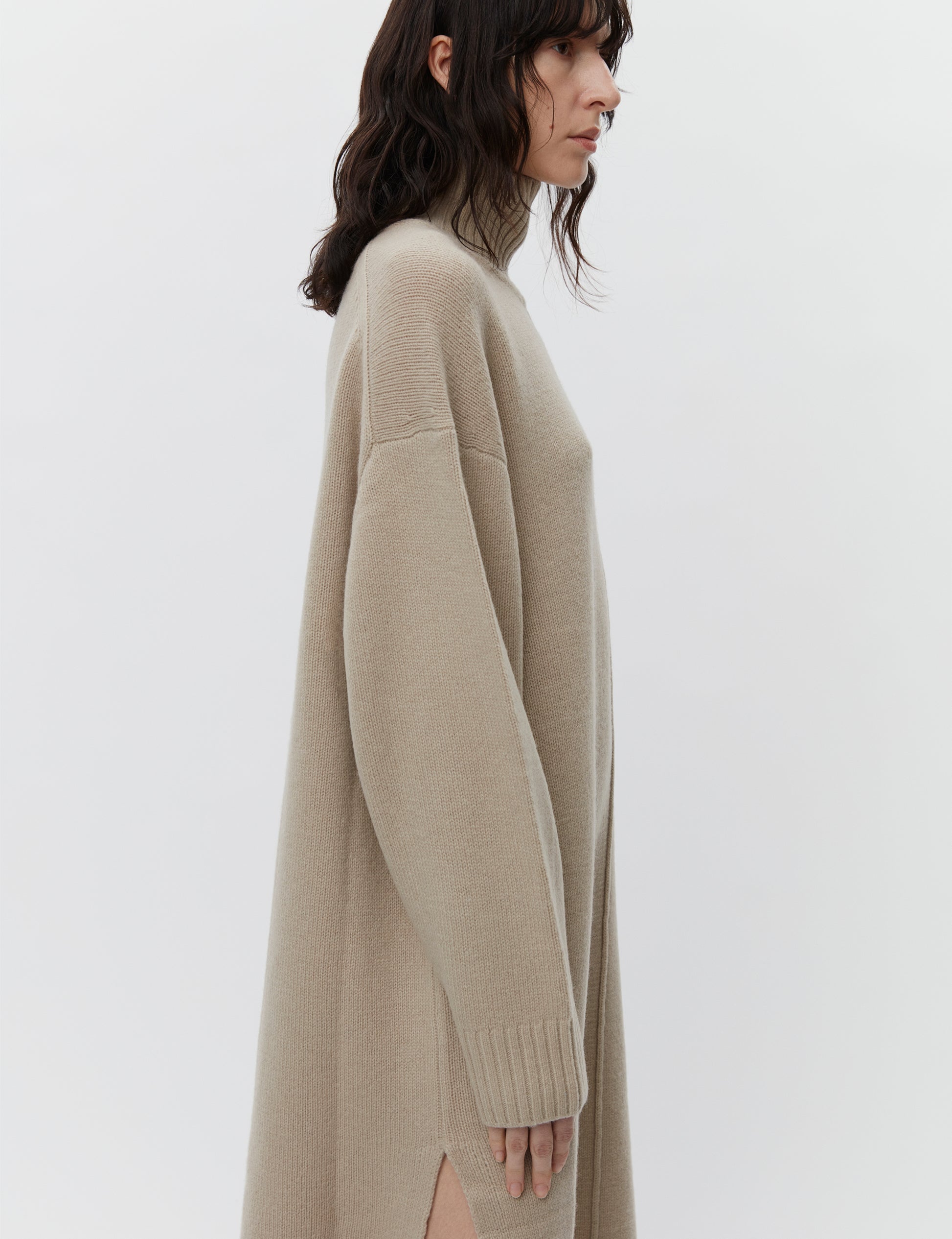 Beige wool dress with a funnel neck and long sleeves