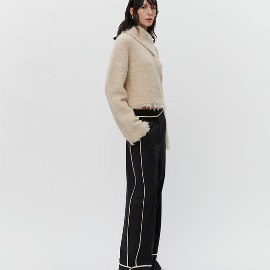 Cream boucle wool jumper with asymetric neckline detail model shot