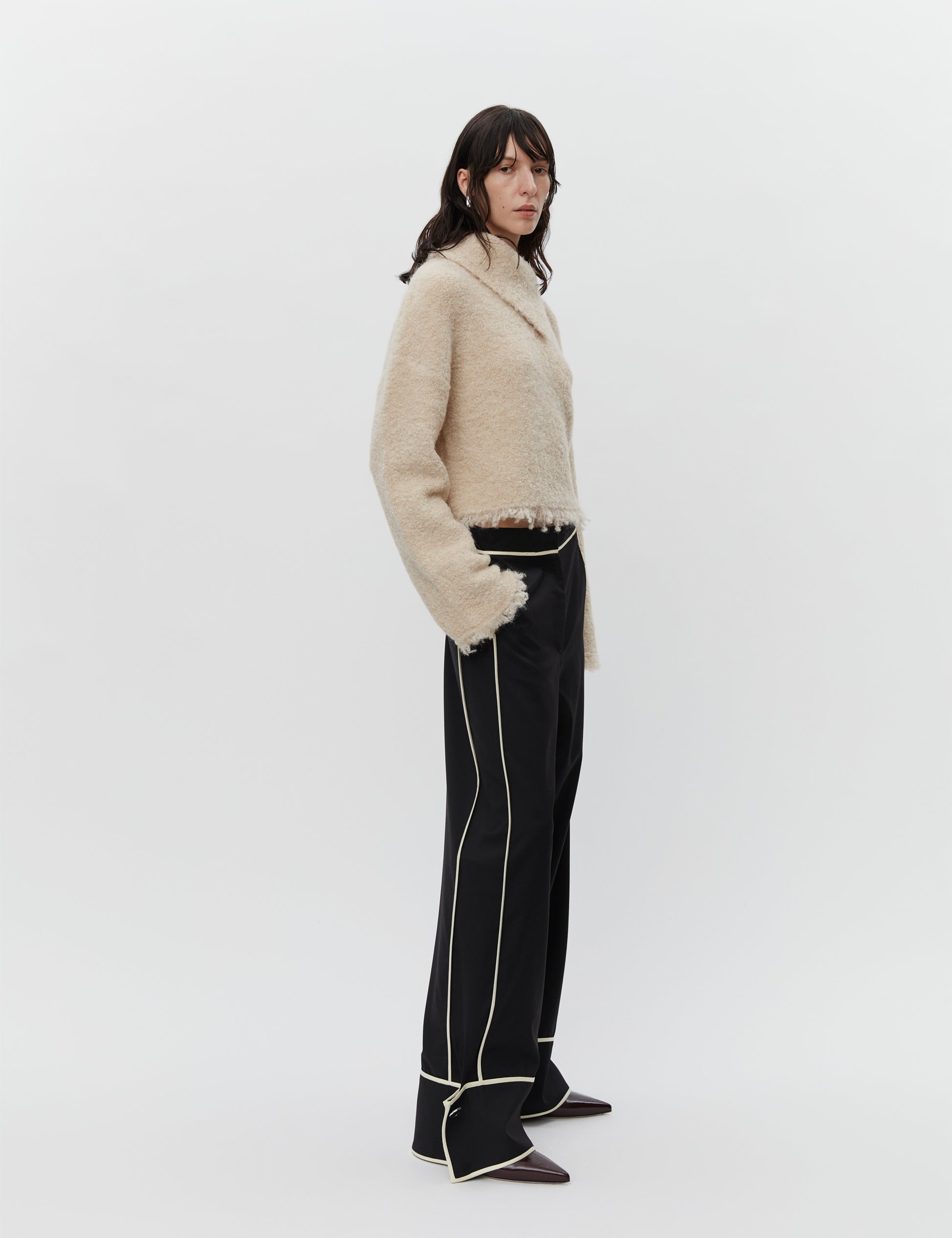 Cream boucle wool jumper with asymetric neckline detail model shot